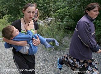 South Ossetians run to take shelter