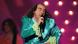 man in green velvet suit singing in stage (picture-alliance/dpa/K. Lenz)