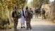 Bundeswehr soldiers talking to an Afghan civilian